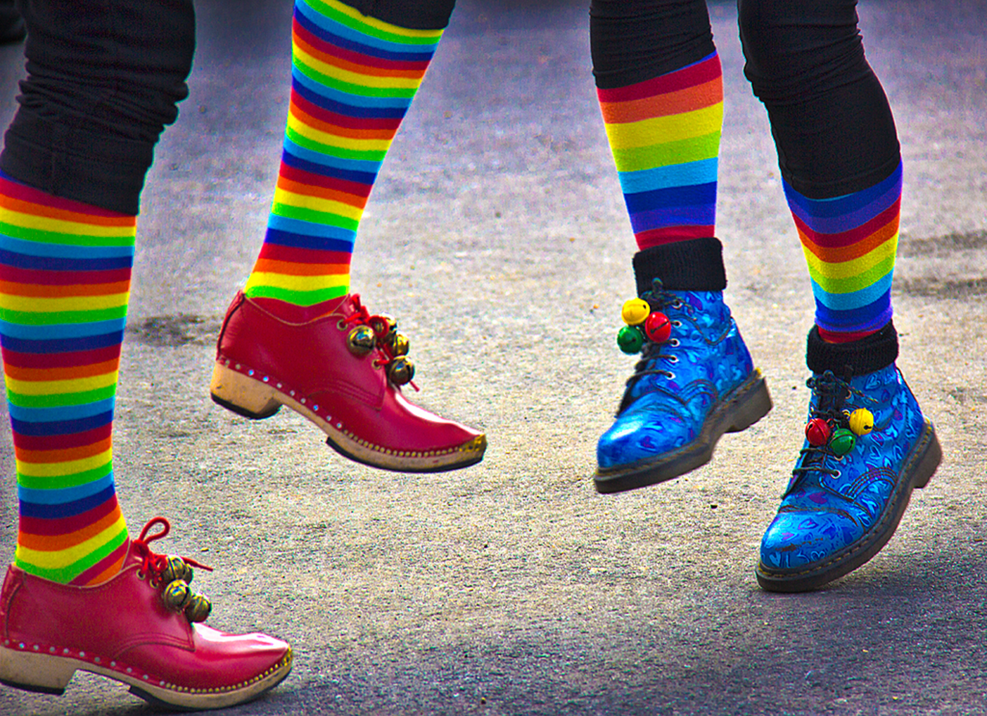 Morris dancer's feet with colourful striped socks and bells
