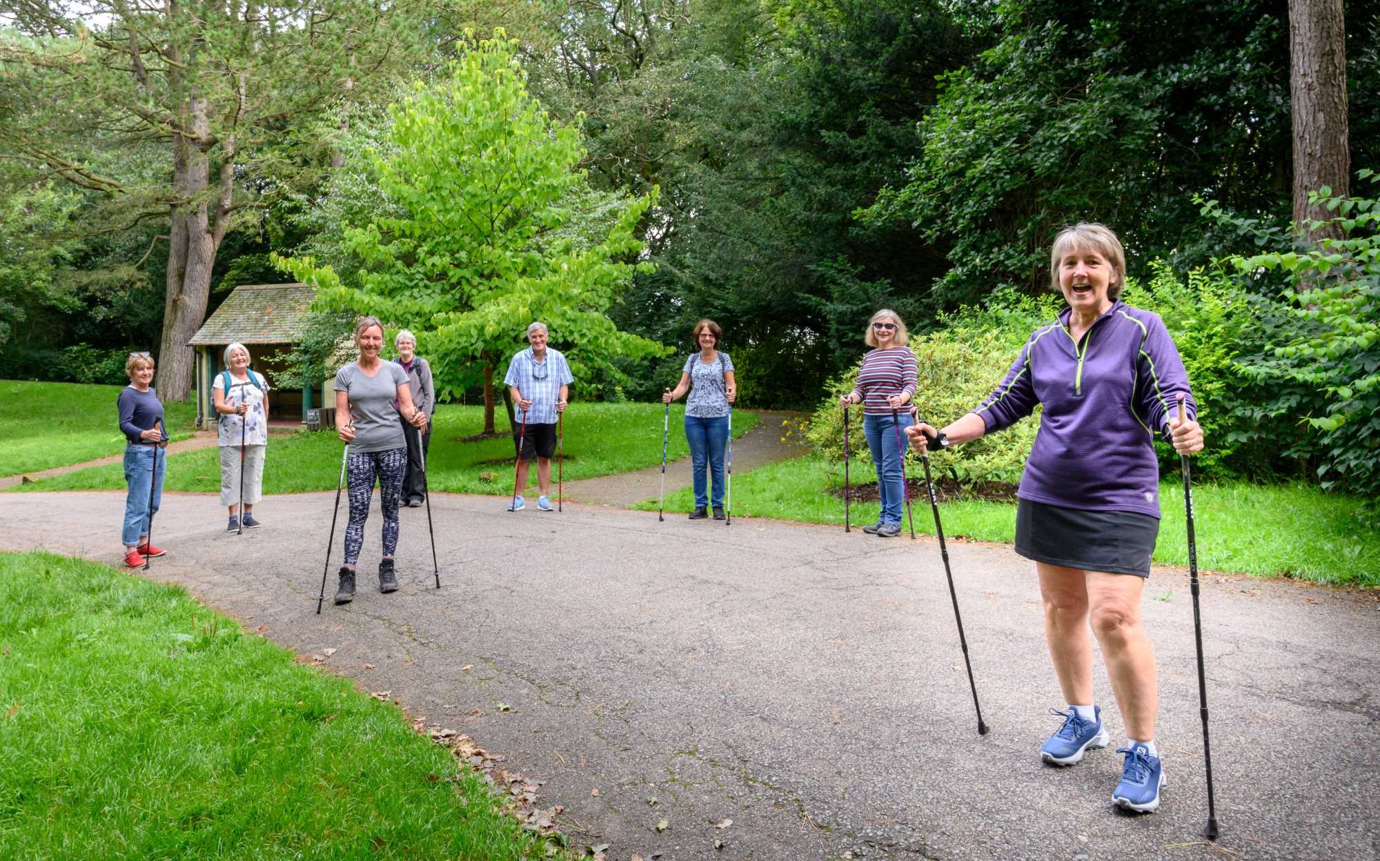 u3a members in a park with walking poles 
