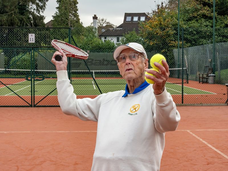 photo of man playing tennis