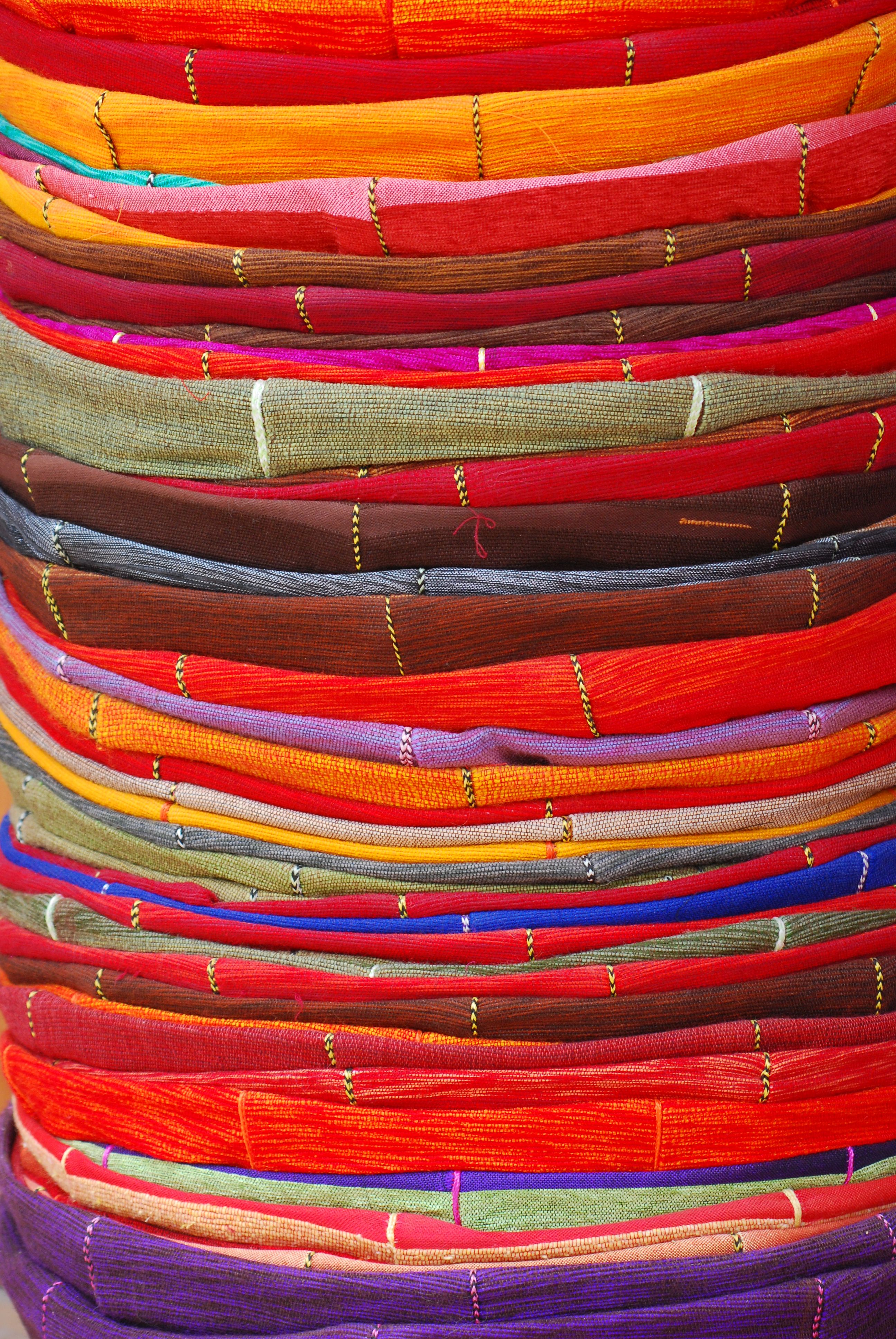 Photo of colourful stack of cushions